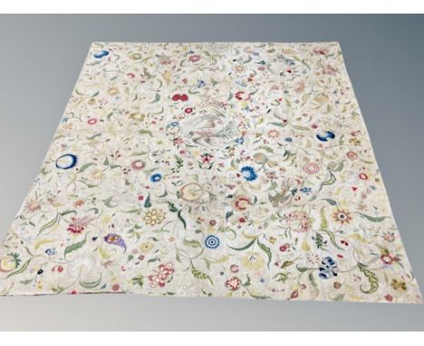 A fabulous 18th century crewel work wall hanging, finely worked in coloured wools on linen, the exquisite branching floral vi