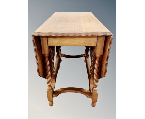 An oak pie crust drop leaf gate leg table 