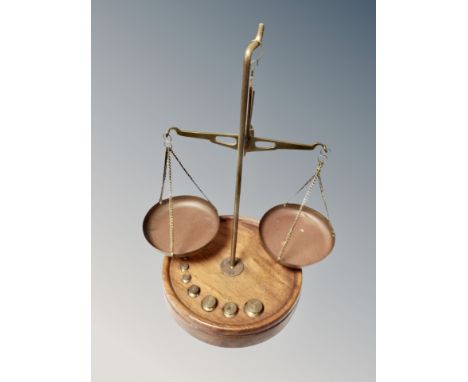 A set of precision balance scales on turned wooden base with weights, height 23 cm 