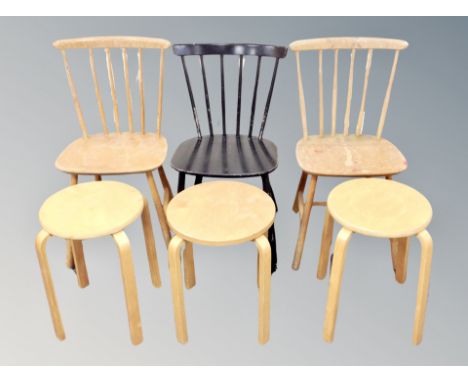 Three bentwood stools and three stick backed chairs 
