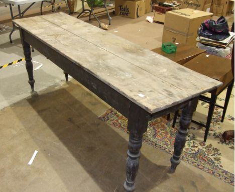 A stained pine narrow kitchen table on turned legs, 53 x 192cm, (in need of restoration) and a trunk.