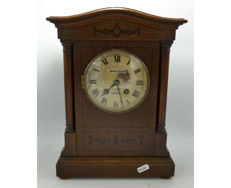 Edwardian Oak cased mantle clock in architectural case: h.35 x w.25cm. 