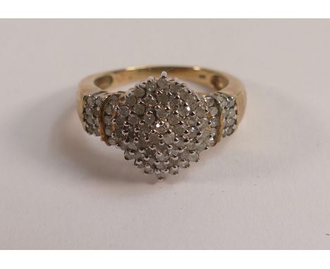 9ct hallmarked diamond set cluster ring, weight 5g, ring size R. Set with a large number of diamonds. 