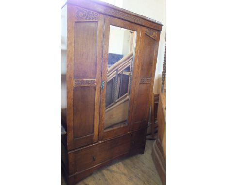 An Oak double wardrobe with single mirror