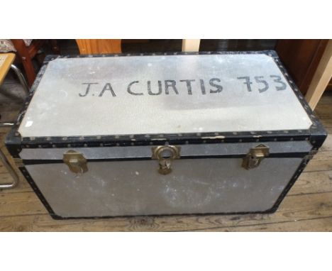 A metal bound travelling trunk