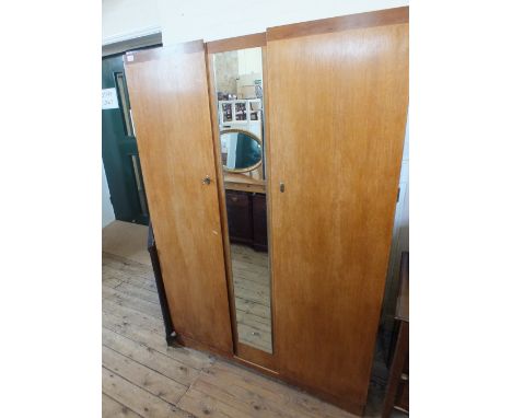 An Oak double wardrobe with single mirror