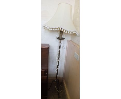 A metal standard lamp