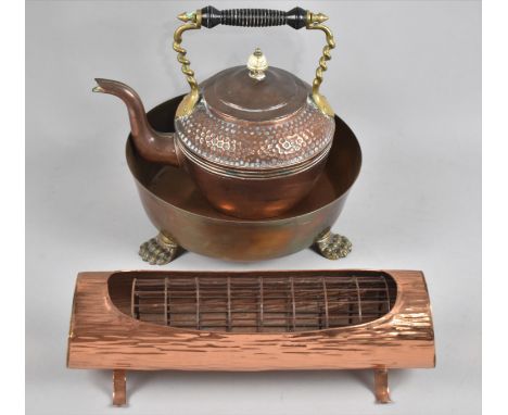 A Copper Planter in the Form of a Log, a Copper and Brass Kettle and a Brass Three Footed Bowl 