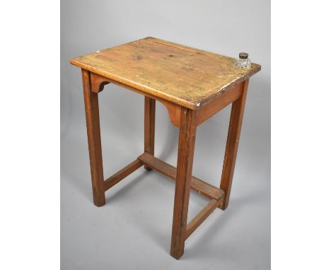 A Stained Pine Work Desk with Inset Glass Inkwell, 60cms Wide and 77cms High 