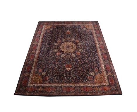 Wilton Persian pattern carpet, central medallion surrounded by jewels and hanging lantern, navy blue ground, eclosed by panel