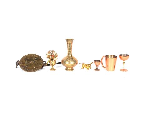 A collection of brass and copper wares; to include an Islamic octagonal coal box; a large circular Islamic brass tray; a meta