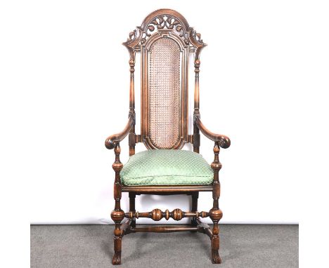 Charles II style high-back chair, circa.1900, carved and pierced cresting, cane back and seat with loose cushion, turned legs