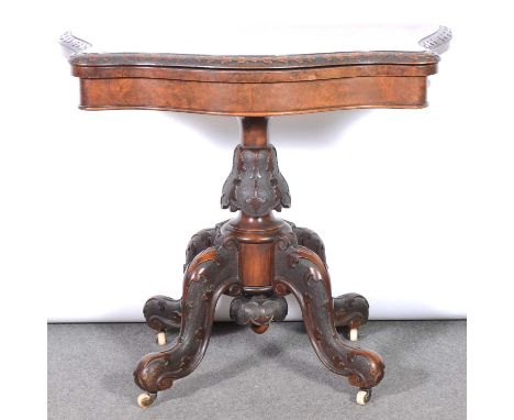Victorian burr walnut card table, serpentine foldover top enclosing a baize lined playing surface, carved column and splayed 