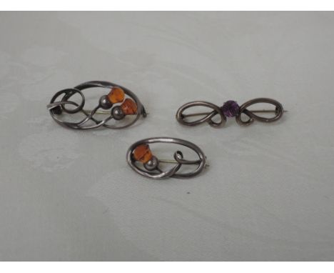 Three HM silver brooches by Charles Horner including Celtic thistles with carved citrines and an amethyst set  knot, all Ches