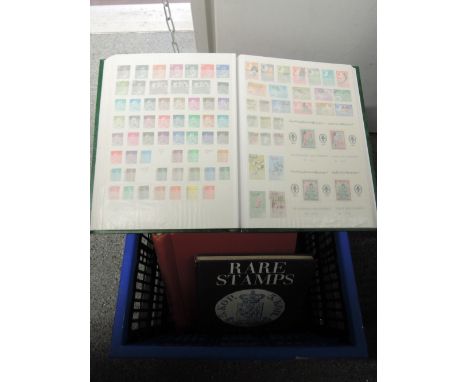 A large box of world stamp albums, mint and used