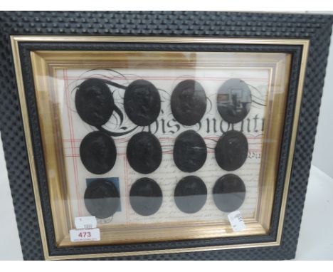 A framed 19th century indenture and twelve oval portrait medallions 