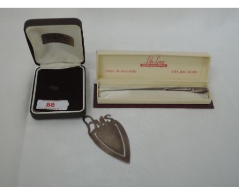 A cased Life Long white metal propelling pencil stamped Sterling Silver having engine turned decoration, and an HM silver boo