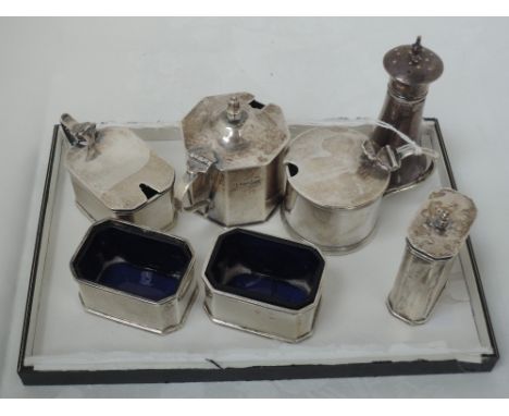 A selection of HM silver cruet items including four piece set of rectangular form having engine turned decoration, approx 350
