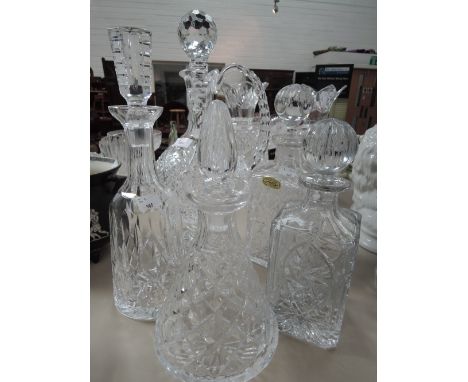 A Waterford crystal decanter and a selection of Irish glass decanters