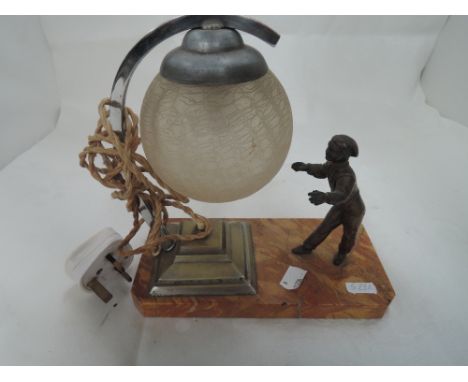 A 1920's table lamp of French style modelled as cast boy throwing crackled ball globe on marble base