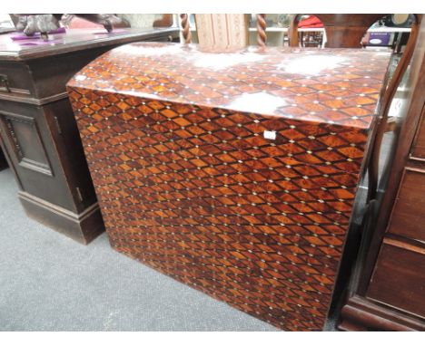 A modern Oriental dome top trunk having inlay and strapwork decoration and lined interior