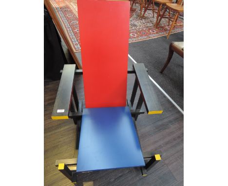 A Cassina Gerrit Reitveld style chair in stylised red, blue, black, yellow laquered multiply design, bearing Cassina stamp an