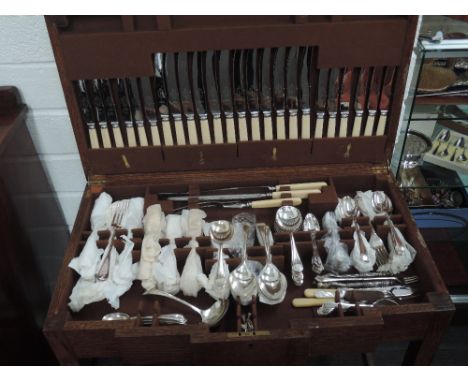 A vintage table canteen of assorted silver plated flatware