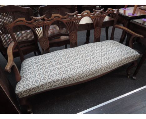 An Edwardian mahogany salon settee having triple crest and splat back over later tapestry upholstery on slender cabriole legs