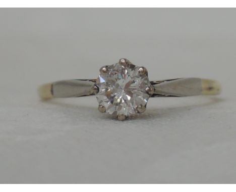 A ladies diamond solitaire ring, approx .45ct in a claw set mount to raised shoulders on a yellow metal loop stamped 18ct