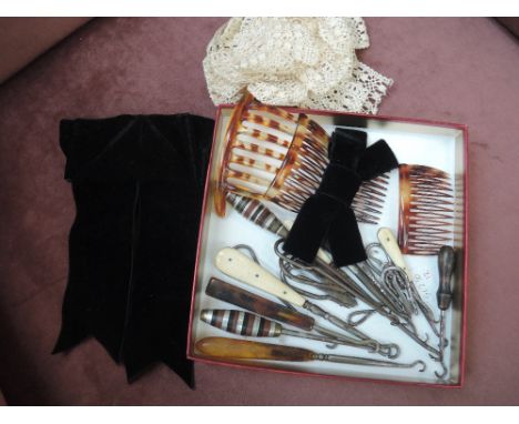 A selection of assorted button hooks and hair combs