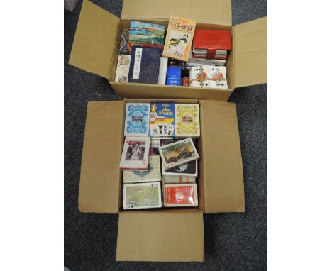 A large collection of playing cards in two boxes