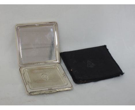 A ladies silver compact of square form having engine turned decoration and plain cartouche, London 1973, Kigu Ltd