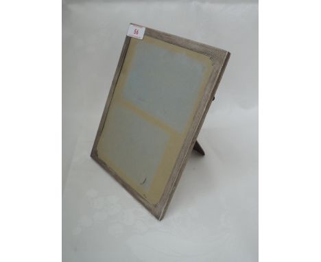 A silver photograph frame of rectangular form having engine turned decoration, Birmingham 1931, Mappin & Webb Ltd
