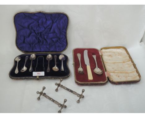 A cased part set of HM silver teaspoons with matched plated sugar nips, a cased child's cutlery set having HM silver spoon an