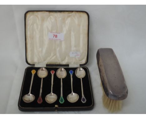 A cased set of six silver teaspoons having stylised enamelled terminals of different colours, Birmingham 1914, William Hair H