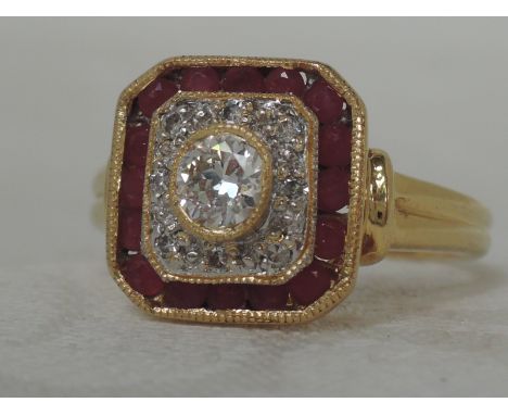 A ladies dress ring having a central diamond, approx .5ct within a diamond chip and ruby border in a square mount on a yellow