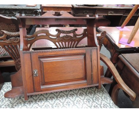 A late Victorian/Edwardian mahogany wall cabinet having shelf and cupboard