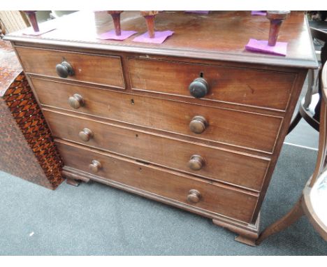 A 19th century mahogany chest of 2 short and 3 long cockbeaded drawers on bracket feet