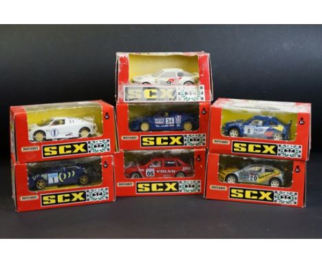 Seven boxed Matchbox SCX slot cars to include Volvo 850T (83920.20), Bugatti (83870.20 - missing wing mirror), Renault Megane