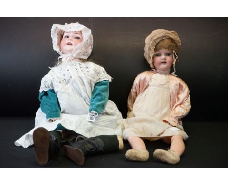 Two Early 20th century Heubach Koppelsdorf Bisque Head Dolls, one with impressed marks 302.9 with fixed blue eyes, open mouth