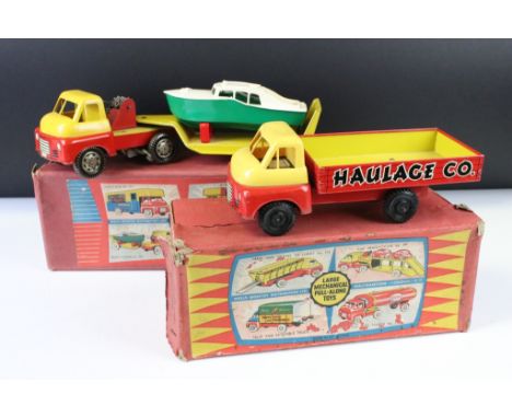 Two boxed Wells Brimtoy Large Mechanical Pull Along Toys tin plate models to include 707 Boat Carrier and 703 Sand &amp; Grav