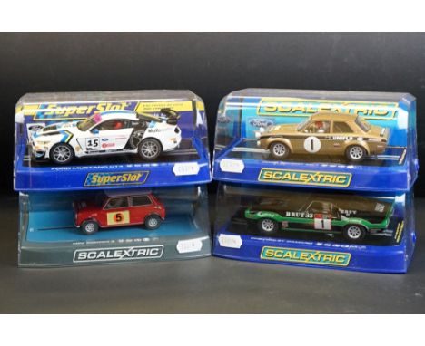 Four cased Scalextric slot cars to include C2920 Ford Escort RS 1600 No 1, C3612 Chevrolet Camaro 1970 Faberge Racing No 1, C
