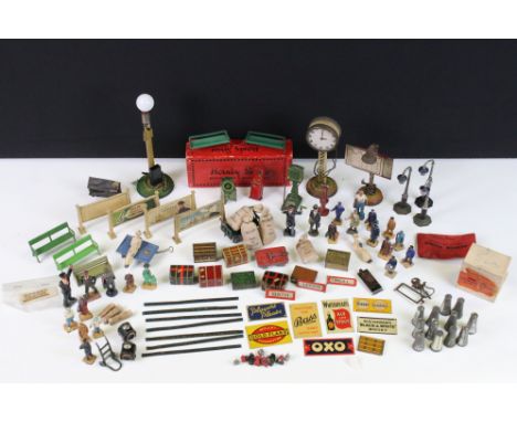 Large group of O gauge station &amp; trackside accessories containing many scare items to include 7 x tin plate platform adve