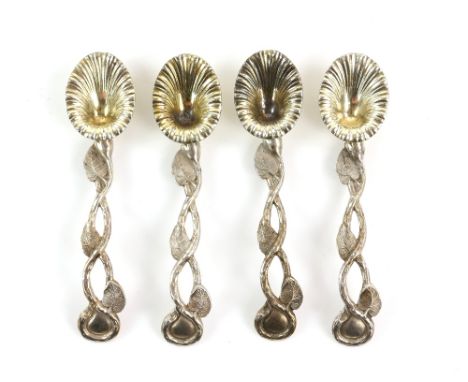Victorian parcel-gilt silver set of four teaspoons, by Joseph Willmore, Birmingham 1838, each comprising a flower-head bowl a