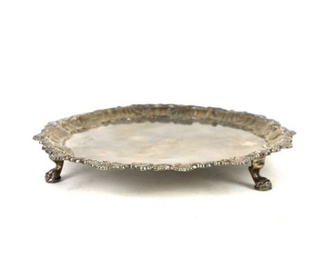 George III silver salver by Elizabeth Cooke, London 1764, the border with shell design, raised on three lion's paw feet, 19 c