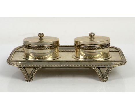 Edward VII silver inkstand, of shaped  rectangular form with gadrooned borders, set with two oval inkwells with screw fixings
