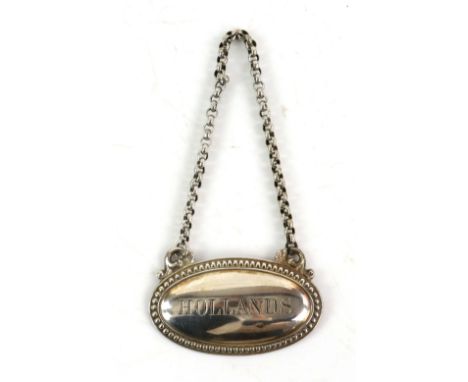 Victorian silver decanter label for Hollands. by James Dixon and Sons, Sheffield 1877, 5.5 cm wide, 11 gr.         