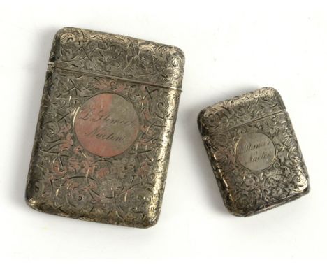 A Victorian  silver card case profusely engraved with flowers and scroll work London 1883 makers Sampson Mordan and Co and a 