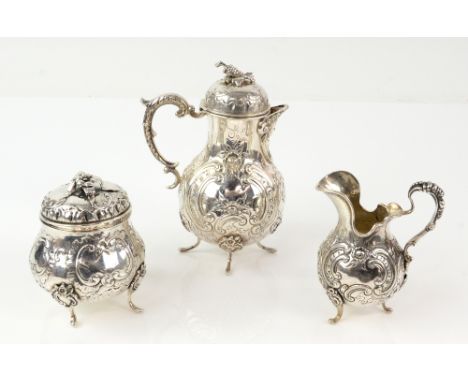 19th century Continental silver three-piece bachelor's tea service, comprising teapot, sugar bowl and cover and cream jug, ea
