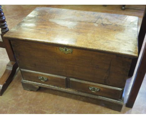 "An antique oak small Dower Chest with hinged lid, fitted two drawers on bracket feet, 2ft 4in W"